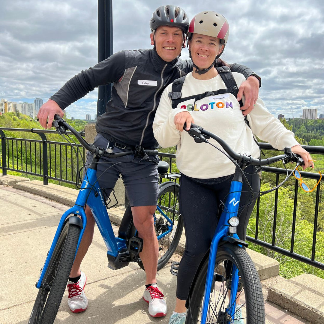 Calgary-things-to-do-best-restaurants-Calgary-date-night-ideas-fun-date-ideas-calgary-bike-tours-Calgary-date-ideas-Calgary-touring-bicycle-couple-in-electric-bike-hugging-romantic-date-ideas-donut-bakeries-calgary