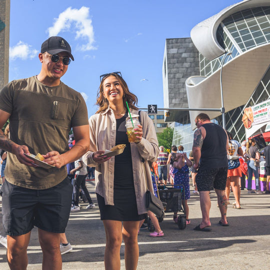 Edmonton-things-to-do-best-restaurants-Edmonton-Alberta-glamping-breweries-Edmonton-biking-tours-best-restraunts-downtown-Edmonton-fun-date-ideas-edmonton-food-bike-tour-taste-of-Edmonton-festival-couple-enjoying-food-in-summer