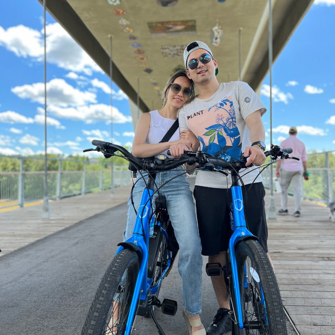Edmonton-things-to-do-cute-date-ideas-Edmonton-Food-tasting-tour-food-bike-tour-best-donuts-Edmonton-Adventure-tour-companies-two-couples-huggin-on-electric-bikes-in-Edmonton-bridge-Alberta-tours