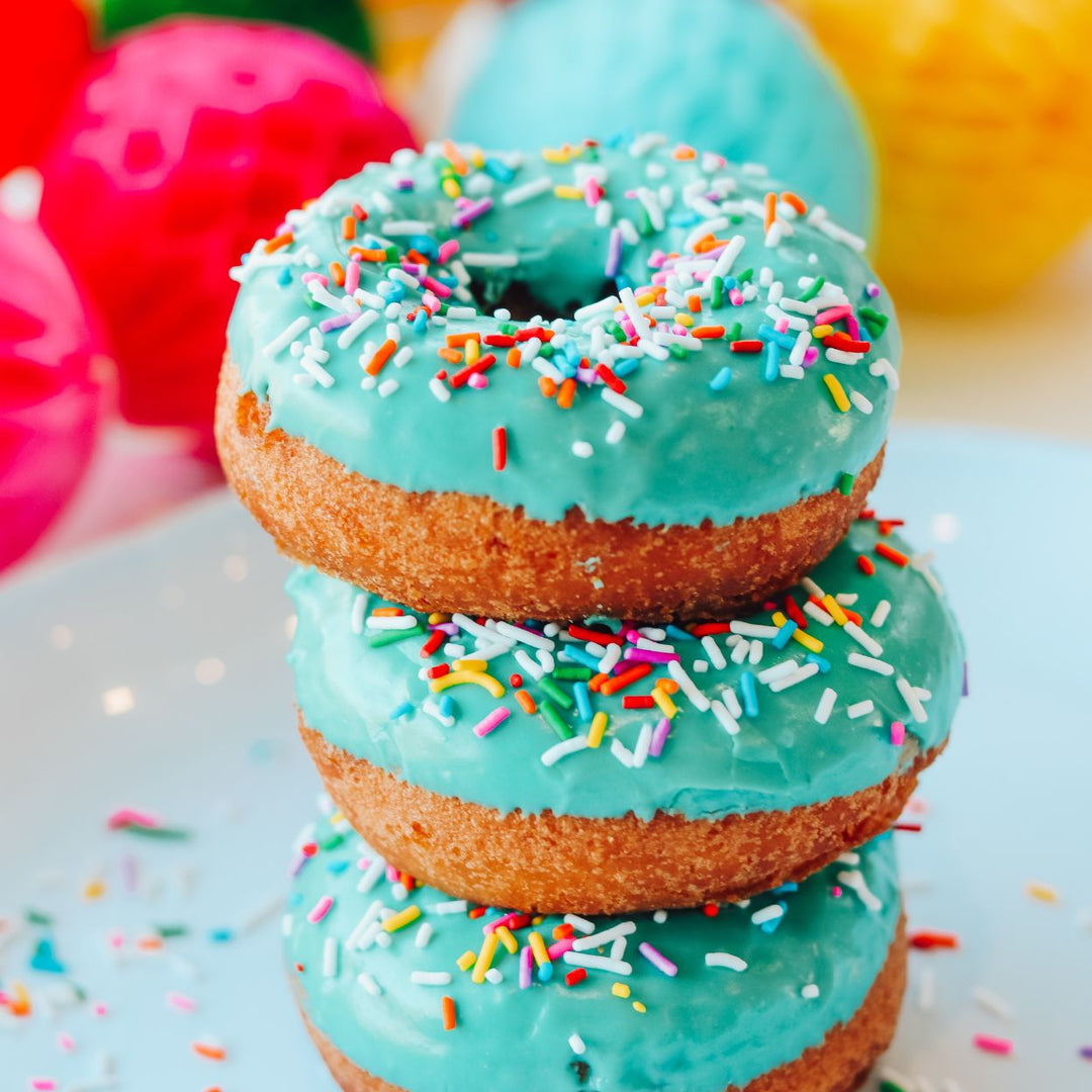 Edmonton-things-to-do-donut-bike-tour-with-food-bike-tour-adventure-edmonton-best-bakeries-Edmonton-food-blog-Edmonton-fun-date-ideas-edmonton-teal-blue-decorated-donuts-3-donuts-on-top-of-each-other-food-bike-tour