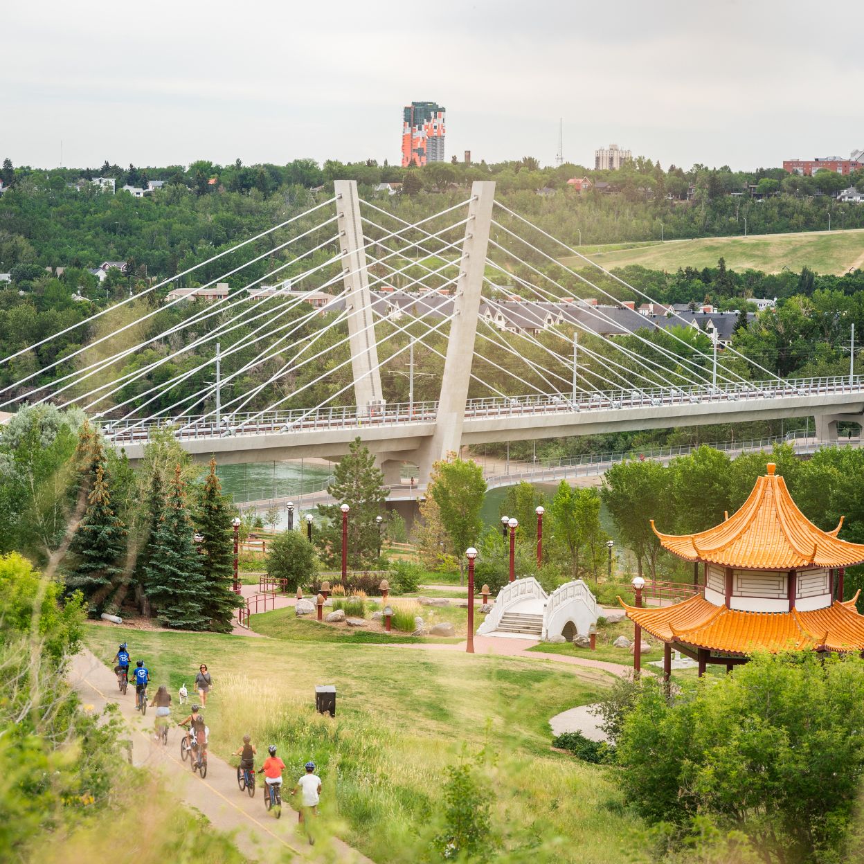Edmonton-things-to-do-river-valley-food-bike-tour-alberta-tours-cute-date-ideas-group-of-people-on-food-bike-tour-in-river-valley-Louise-McKinney-Riverfront-park